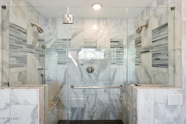 bathroom with a shower with shower door