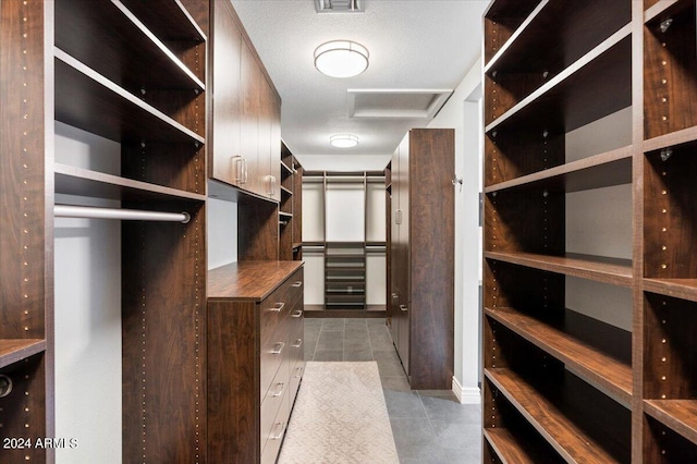 spacious closet featuring light tile patterned floors