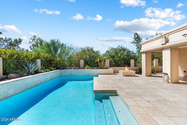 view of swimming pool featuring a patio area