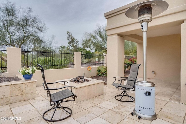 view of patio / terrace featuring an outdoor fire pit