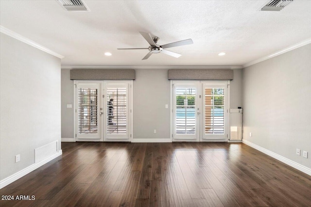 unfurnished room with ceiling fan, ornamental molding, a textured ceiling, and dark wood-type flooring