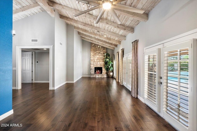 unfurnished living room featuring wood ceiling, ceiling fan, beamed ceiling, and dark wood-type flooring