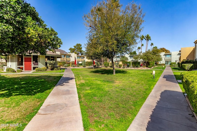 surrounding community featuring a residential view and a yard