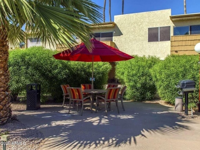 view of patio featuring outdoor dining space and area for grilling