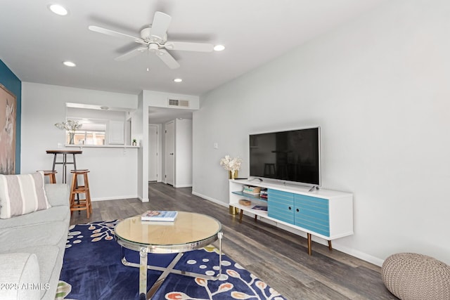 living area with recessed lighting, ceiling fan, baseboards, and wood finished floors