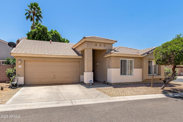 6631 E Rhodes St, Mesa, AZ 85215 - view of front of home with an attached garage, a tile roof, concrete driveway, and stucco siding