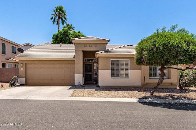 6631 E Rhodes St, Mesa, AZ 85215 - view of front of house with a garage, stucco siding, driveway, and a tiled roof