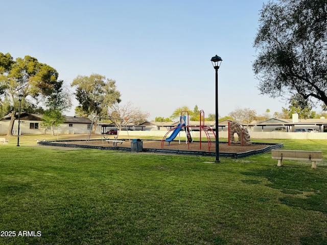 community playground featuring a lawn