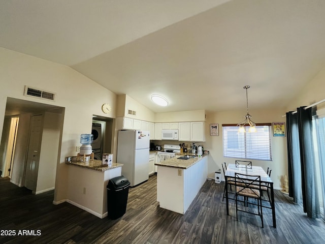 kitchen featuring lofted ceiling, a peninsula, white appliances, visible vents, and white cabinets