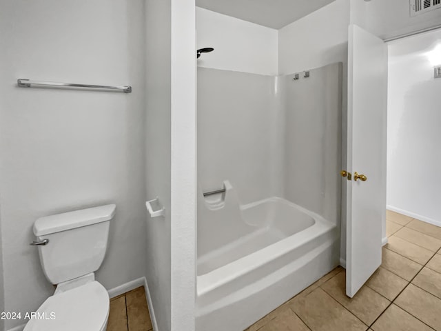 bathroom featuring tile patterned flooring and toilet