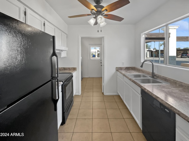 kitchen with ceiling fan, sink, black appliances, light tile patterned floors, and white cabinetry