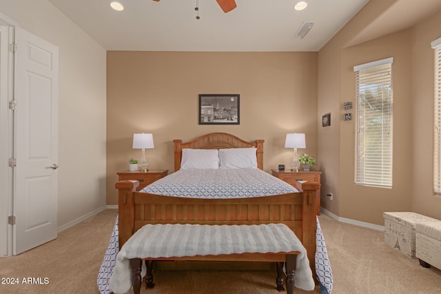 bedroom with light carpet and ceiling fan