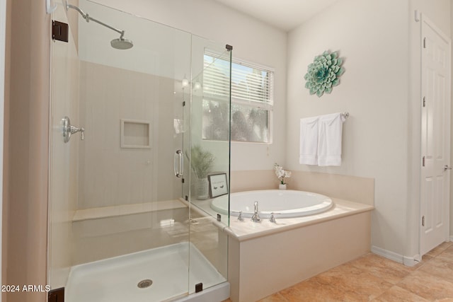 bathroom featuring separate shower and tub and tile patterned floors