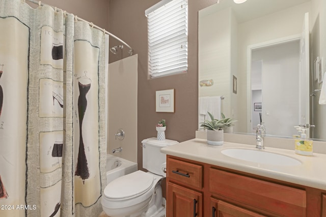 full bathroom with vanity, shower / bath combination with curtain, and toilet