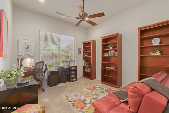 office area with ceiling fan and light colored carpet