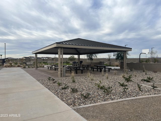 surrounding community featuring fence and a gazebo