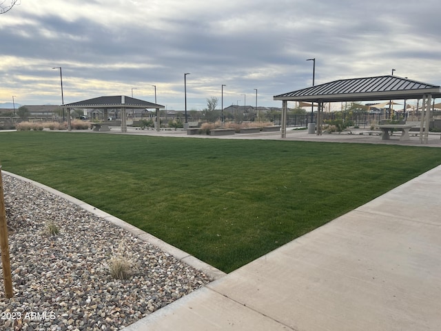 view of community with a lawn and a gazebo