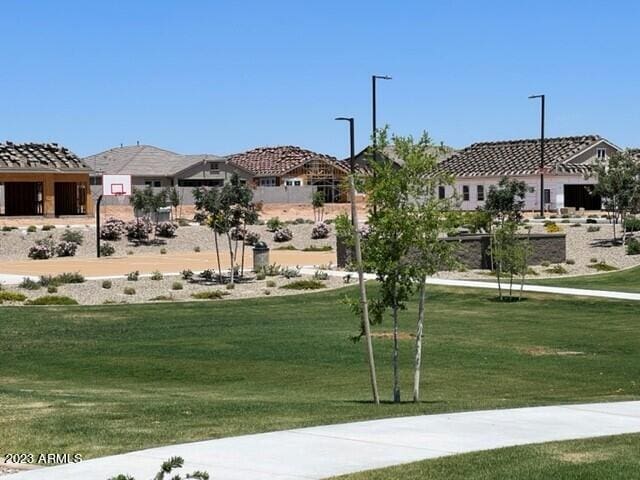 view of community with a residential view and a lawn