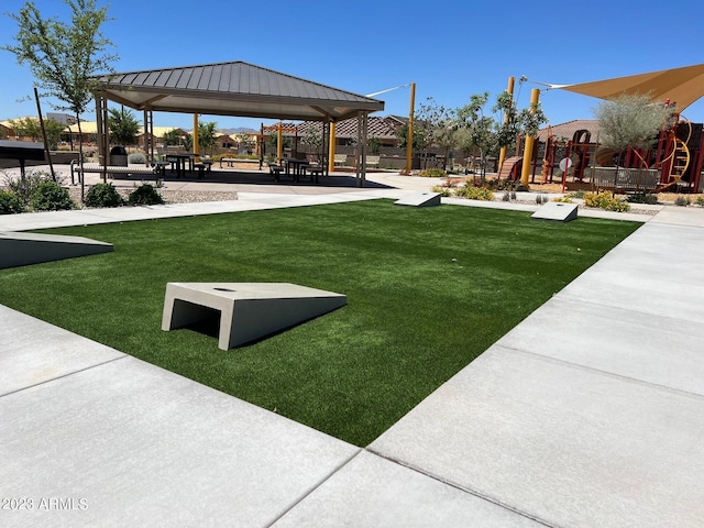 surrounding community featuring a gazebo, a yard, and playground community