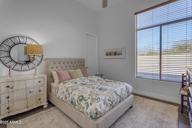 bedroom featuring a ceiling fan and baseboards