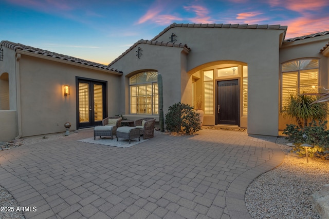 patio terrace at dusk with french doors