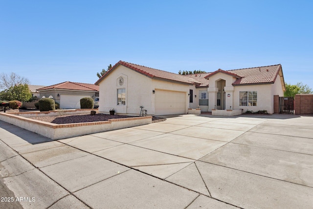 mediterranean / spanish house with a garage