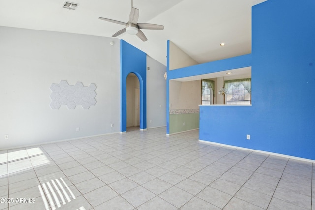 tiled empty room featuring ceiling fan and lofted ceiling