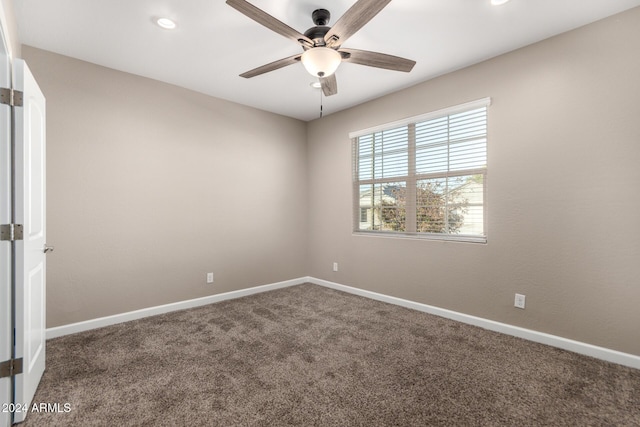 carpeted empty room featuring ceiling fan