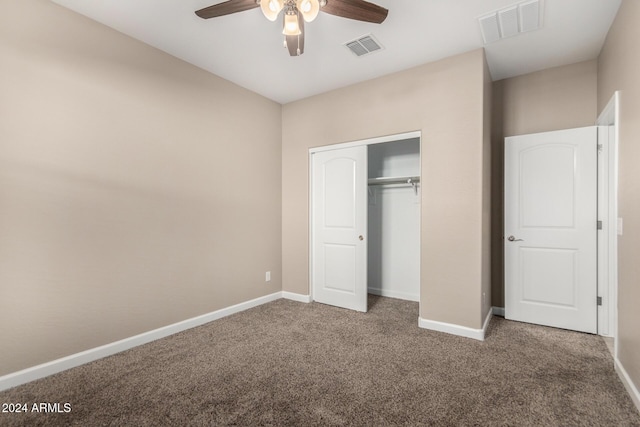 unfurnished bedroom featuring carpet, ceiling fan, and a closet