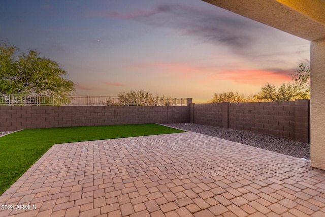 patio terrace at dusk with a yard