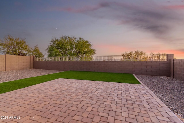 view of patio terrace at dusk