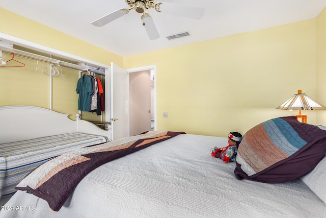 bedroom with ceiling fan and a closet