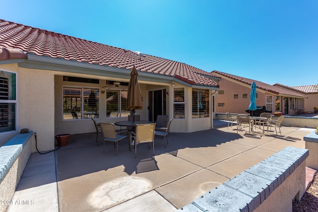 view of patio / terrace featuring ceiling fan