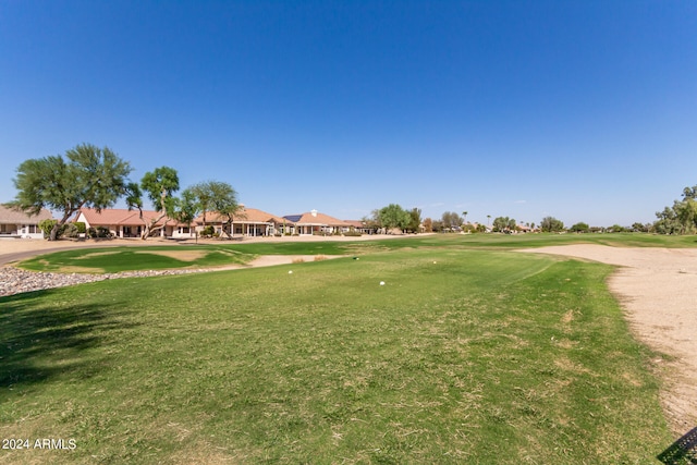 view of home's community featuring a lawn