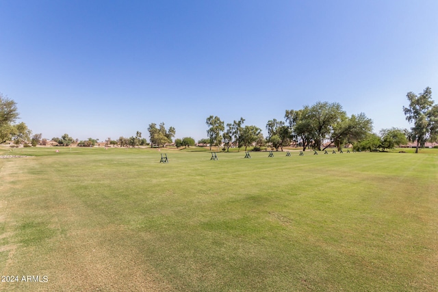 surrounding community featuring a yard