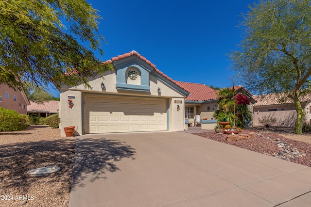 mediterranean / spanish-style house featuring a garage