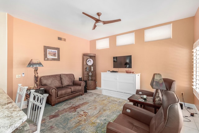 living room with ceiling fan and light tile patterned flooring