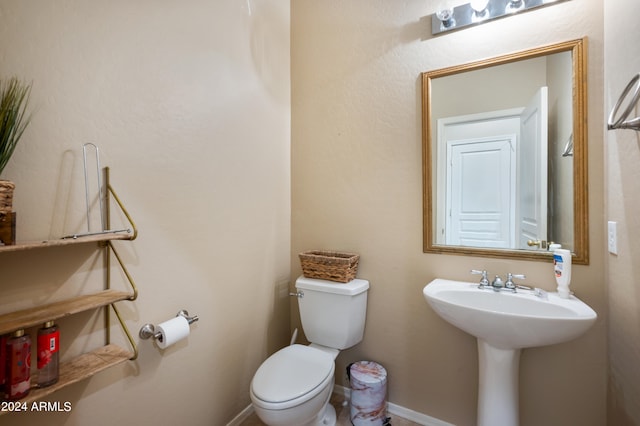 bathroom featuring sink and toilet