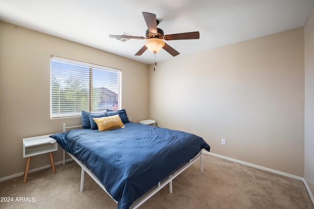 bedroom with light colored carpet and ceiling fan