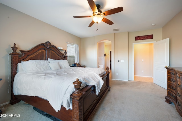 bedroom featuring light carpet and ceiling fan