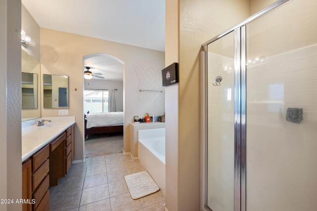 bathroom with tile patterned flooring, shower with separate bathtub, vanity, and ceiling fan