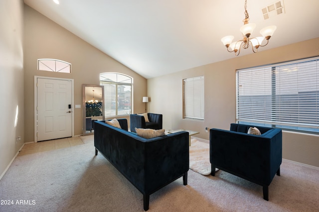 carpeted living room with high vaulted ceiling and a chandelier