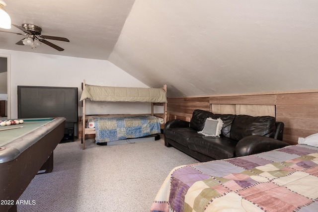 bedroom featuring pool table, wooden walls, vaulted ceiling, light colored carpet, and ceiling fan