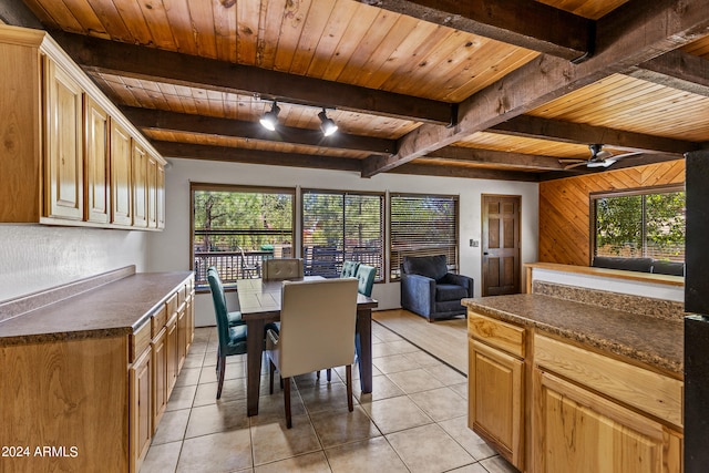 kitchen featuring wood ceiling, ceiling fan, light tile patterned floors, and beamed ceiling