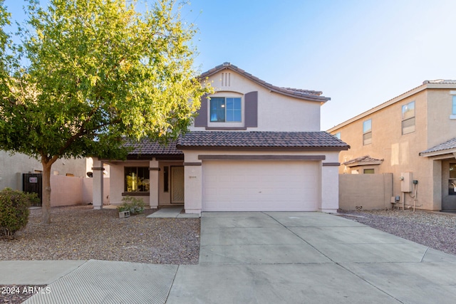 front of property with a garage