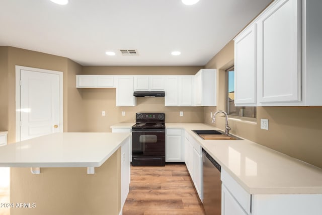 kitchen with dishwasher, light wood-type flooring, black / electric stove, a kitchen island, and white cabinetry