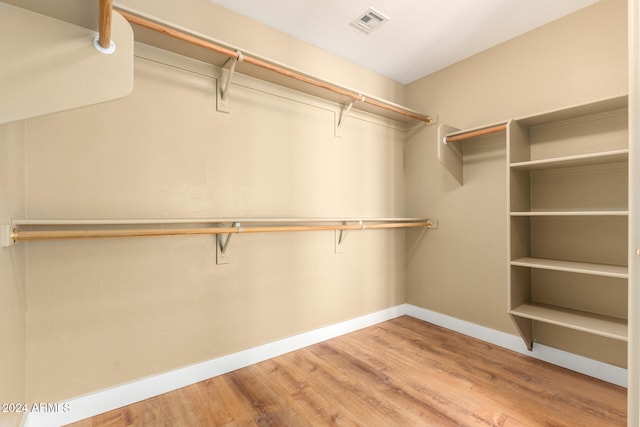 spacious closet featuring wood-type flooring