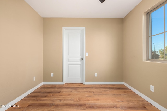 unfurnished room featuring light hardwood / wood-style floors