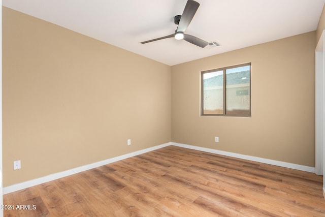 spare room with ceiling fan and light hardwood / wood-style floors