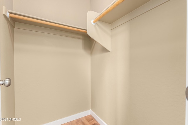 spacious closet featuring light wood-type flooring